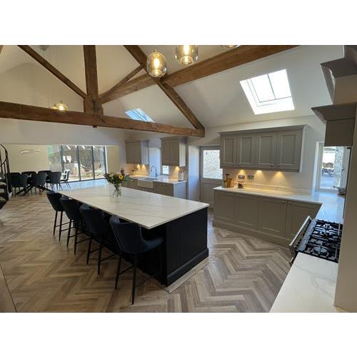 Farm house style kitchen with grey cabinets carrara marble worktops and exposed wood ceiling beams 500x500