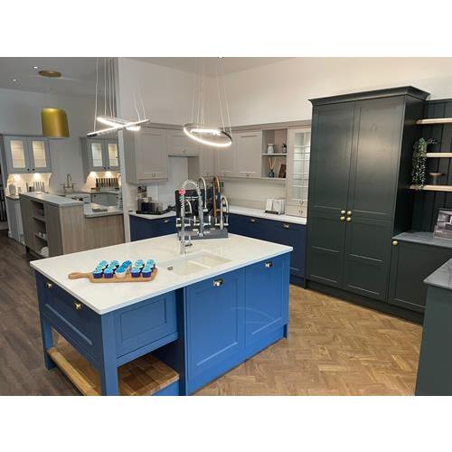 Fitted kitchen with dark grey cabinets and cerulean blue island white quartz worktops 500x500