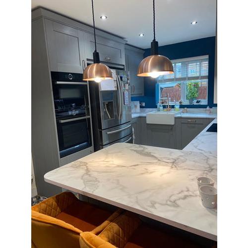Fitted kitchen with full-height grey cabinets marble worktops and over counter lighting 500x500