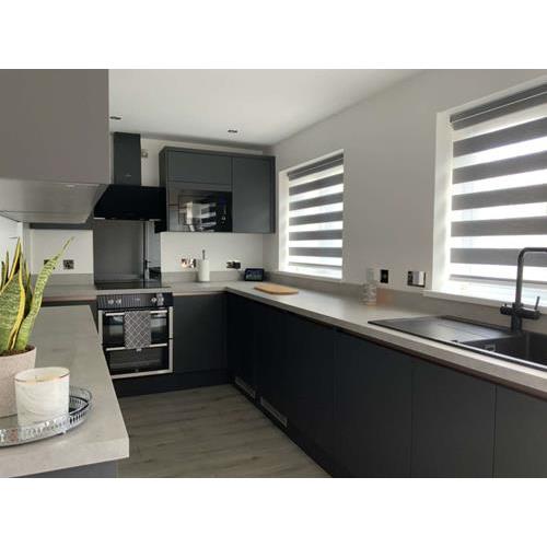 Modern grey fitted kitchen cabinets with light marble worktops 500x500